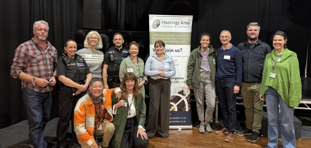 Representatives from Hastings Chamber, Sussex Police, Hastings Borough Council, and Love Hastings gathered in front of Hastings Chamber banner